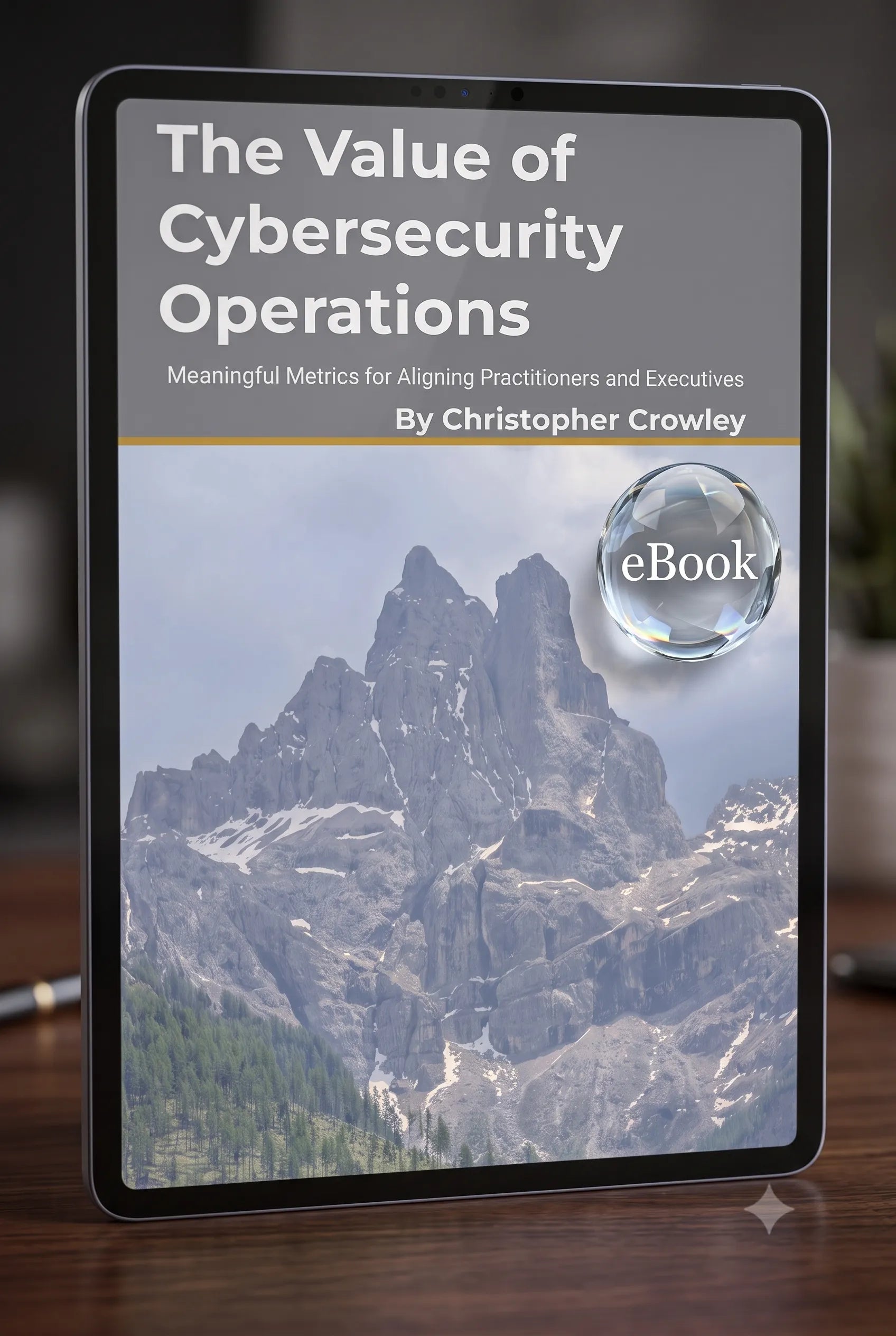 A digital eBook cover for 'The Value of Cybersecurity Operations' by Christopher Crowley, displayed on a tablet screen. The cover features a mountain landscape with a glass sphere graphic containing the word 'eBook'.